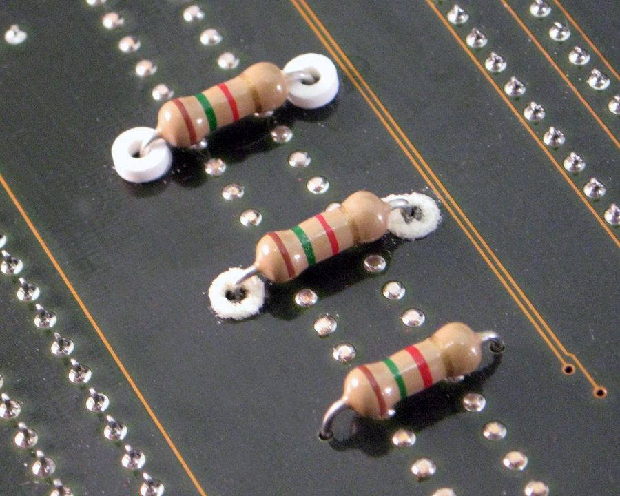 Wash-Aways dissolvable rings spacing capacitors on printed circuit board
