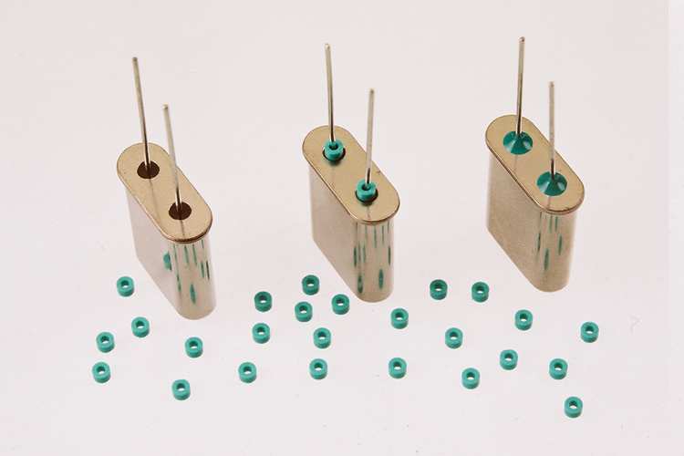 Fifth slide of capacitors sealed with Uni-form epoxy preforms