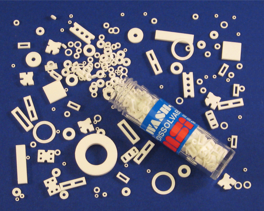 Sample vial of Wash-Aways dissolvable spacers in a variety of shapes and sizes